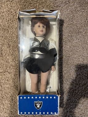 Black & Silver Raiders Cheerleader Doll - Official NFL Team Collectible